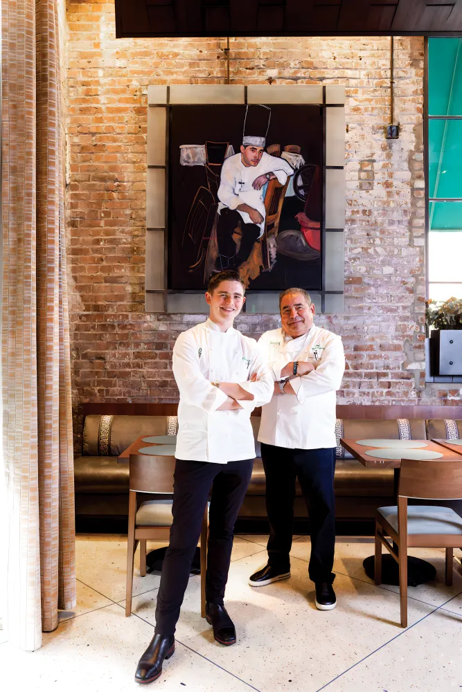 Équipe père-fils au restaurant renommé Emeril.